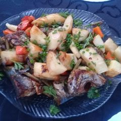 A picture of Grilled carapau and potatoes.