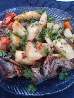 A picture of Grilled carapau and potatoes.