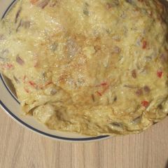 A picture of Sweet potatoes covered with omelette.