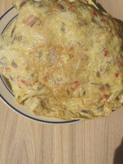 A picture of Sweet potatoes covered with omelette.