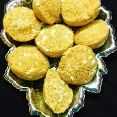 A picture of Gudh Narkoler Mishti Bhapa (Steamed pancake with coconut & jaggery).