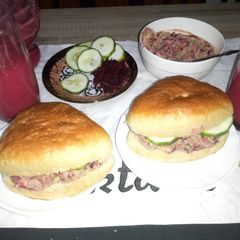 A picture of Buns with ovacado,beetrootpaste n cucumber and fruit juice.
