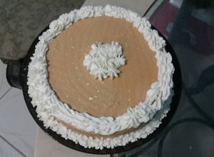 Una foto de Pastel fácil con cubierta de dulce de leche y queso