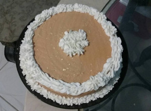 Una foto de Pastel fácil con cubierta de dulce de leche y queso