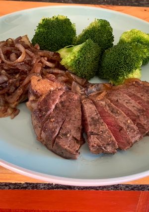 A picture of Pan fried Steak and Balsamic Onions.