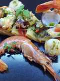 Paccheri con pesce, peperoni corno e olio aromatizzato con menta e basilico