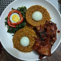 A picture of Bright light Jellof & P.P Chiken -fish with Sunrise Spinach.
