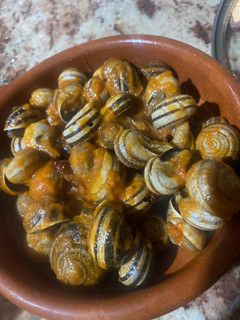 Una foto de Caracoles en salsa con picante