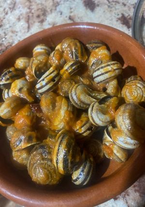 Una foto de Caracoles en salsa con picante
