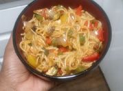 A picture of spaghetti with hotdogs