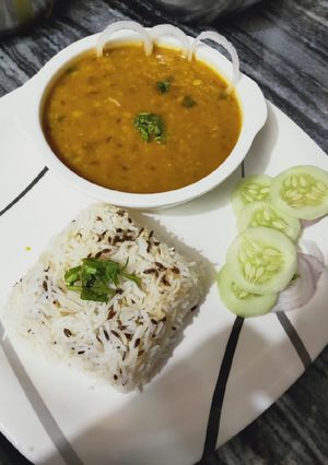 A picture of Sunday dal with jeera rice and salad.
