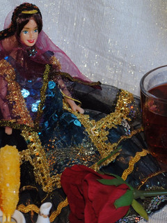 A picture of Persian black tea with dried rose petals.
