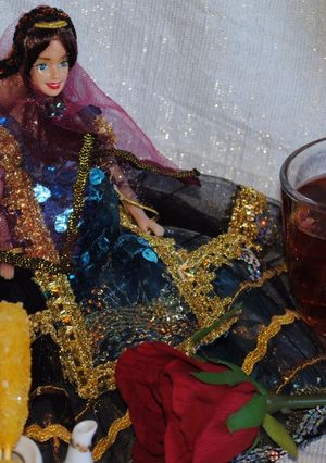 A picture of Persian black tea with dried rose petals.