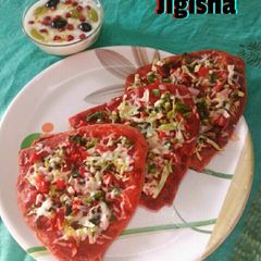 A picture of Mix veg double Decker cheese pizza parantha.