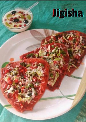 A picture of Mix veg double Decker cheese pizza parantha.