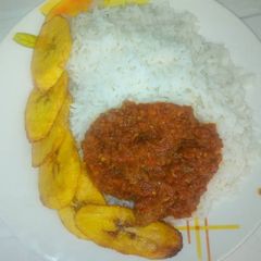 Rice with sauce and fried plantain A picture of Rice with sauce and fried plantain.