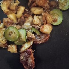 A picture of Sautéed Duck Breasts with Potatoes and Zucchini with a hint of foie gras.