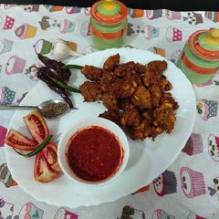 A picture of Red chili garlic spicy chattny sweet corn pakory.