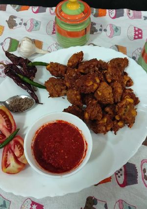 A picture of Red chili garlic spicy chattny sweet corn pakory.