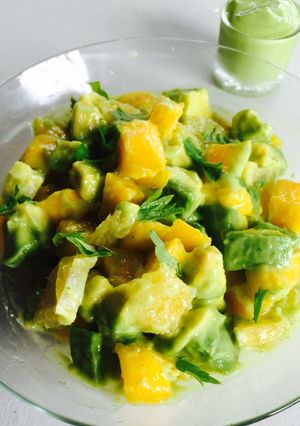 A picture of Avocado, Mango, Orange Salad tossed in an Avocado Salad Dressing.