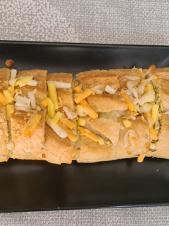 Una foto de Pan de ajo con queso