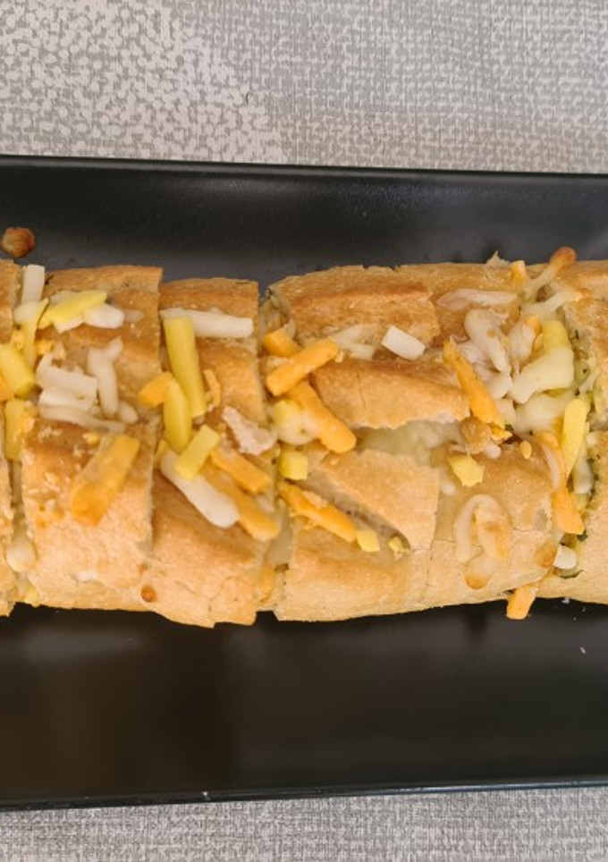 Una foto de Pan de ajo con queso