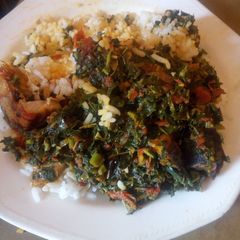 A picture of White rice and vegetable sauce.