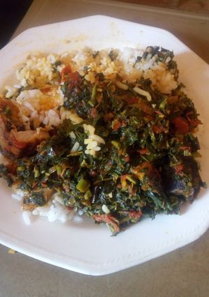 A picture of White rice and vegetable sauce.
