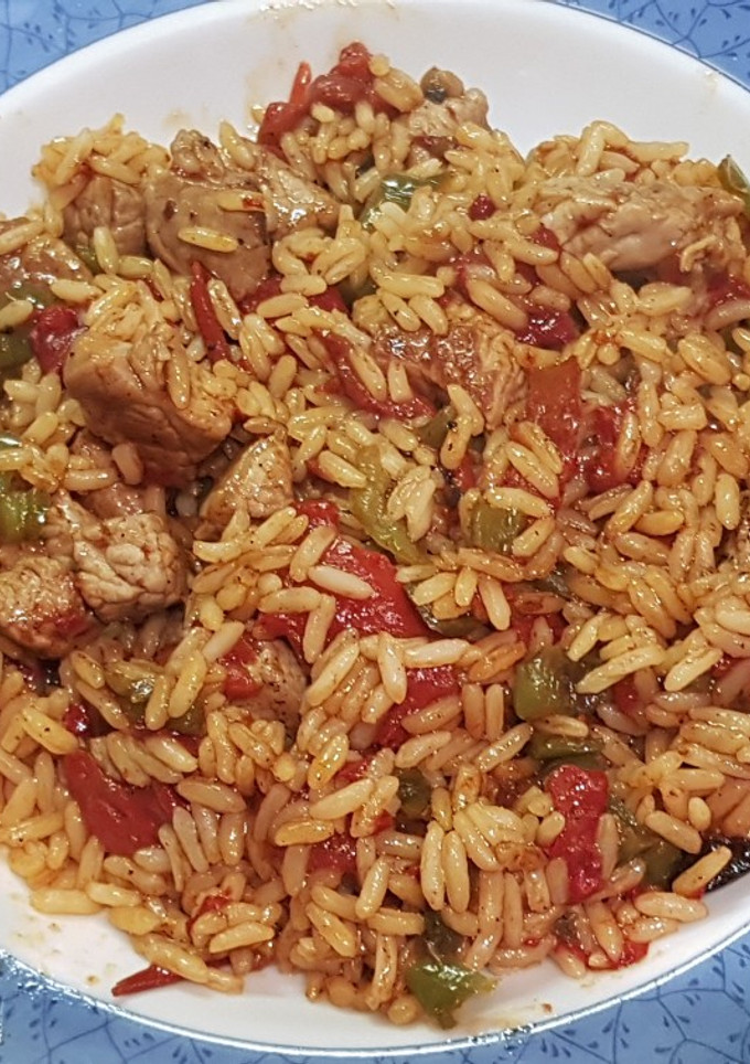 Una foto de Ternera con arroz basmati frito y doble pimiento