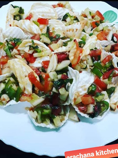 A picture of Potato chips with salsa.