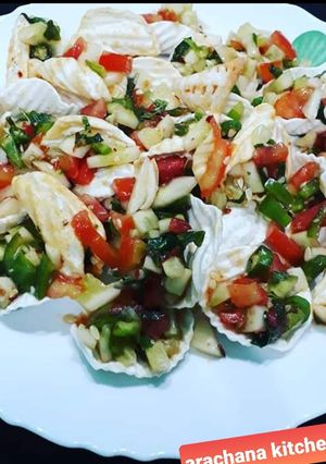 A picture of Potato chips with salsa.