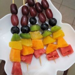 A picture of Rainbow fruit skewers.