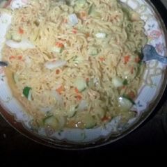 A picture of Indomie with cucumber.