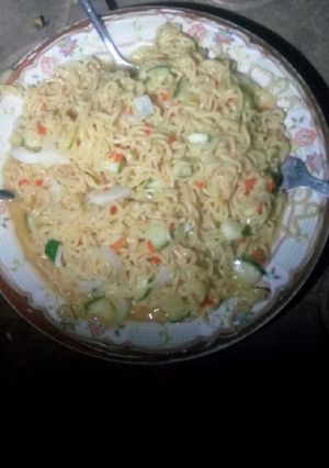 A picture of Indomie with cucumber.