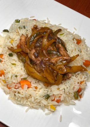 A picture of Vegetable rice and chicken stir fry.