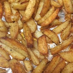 A picture of Oven fried Parmesan potatoes.