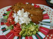Una foto de milanesas de cerdo a la plancha