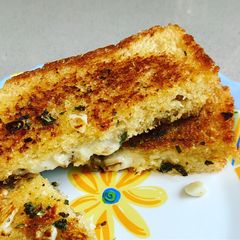 A picture of Garlic bread on pan.