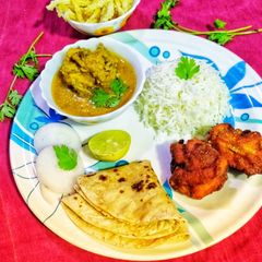 A picture of Dal Gosht instant chicken 65 Thali.