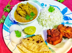 A picture of Dal Gosht instant chicken 65 Thali.