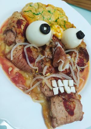 Una foto de Cerdo con sesos de hojaldre de mozzarella
