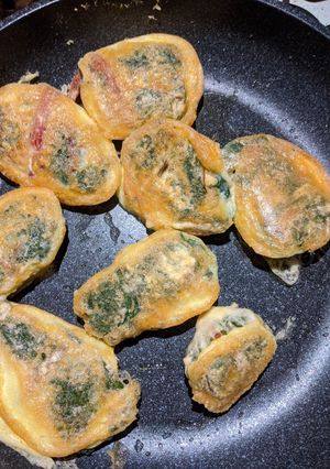 Una foto de Rollitos de acelga y queso capeados