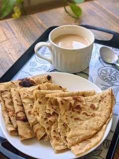 A picture of Layered Chapatis with tea.