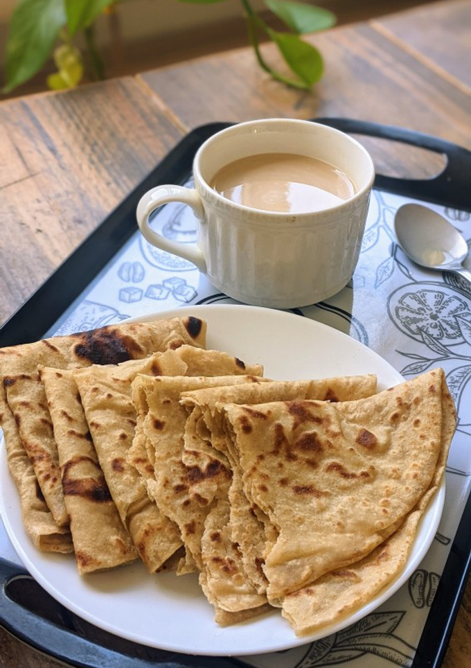 A picture of Layered Chapatis with tea.