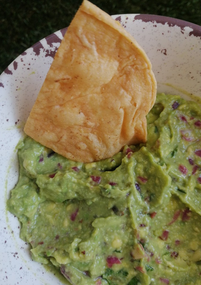 Una foto de Guacamole con sobritas del pedido de la taquería