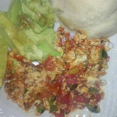 A picture of Fried Eggs, Ugali and Avocado.