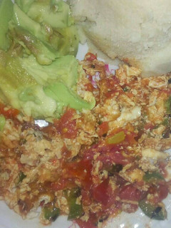 A picture of Fried Eggs, Ugali and Avocado.
