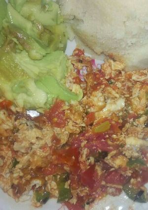 A picture of Fried Eggs, Ugali and Avocado.