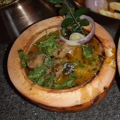 A picture of Kashmiri Nadru yakhni/ Lotus Root in white gravy   .