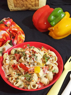 A picture of Macaroni in Mushroom and bell pepper sauce.